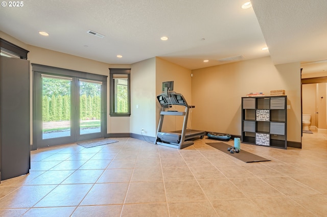 21106 NW 3rd Ct, Ridgefield, WA 98642 - exercise area with light tile patterned flooring, a textured ceiling, and recessed lighting