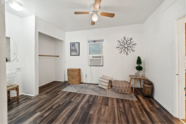 unfurnished room with dark hardwood / wood-style floors, ceiling fan, and cooling unit