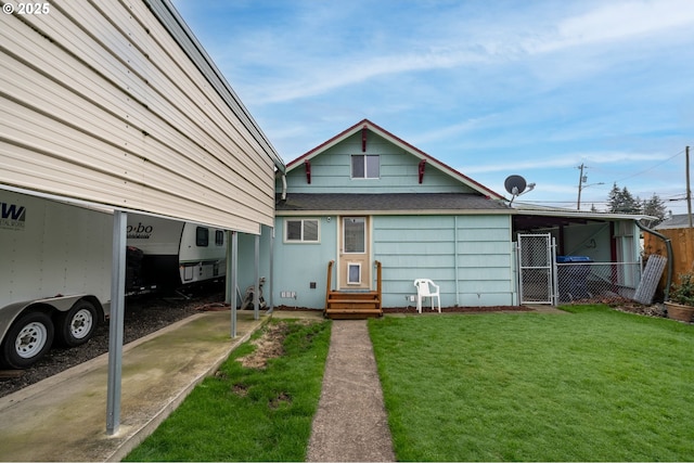 bungalow-style home with a front yard and a carport