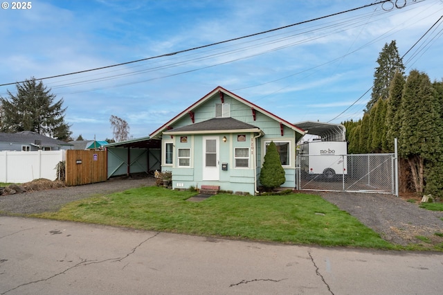 bungalow-style house with a carport and a front lawn