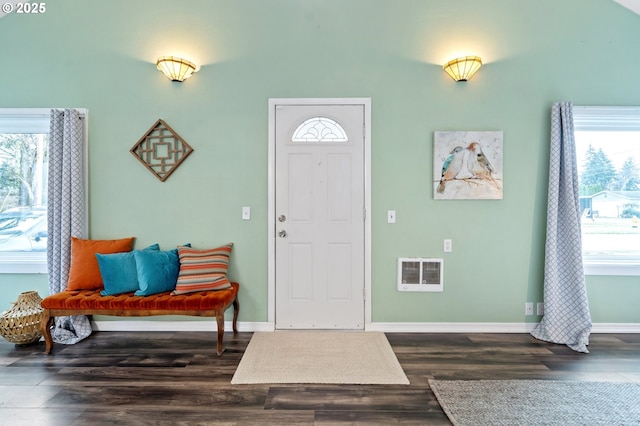 foyer with dark hardwood / wood-style floors