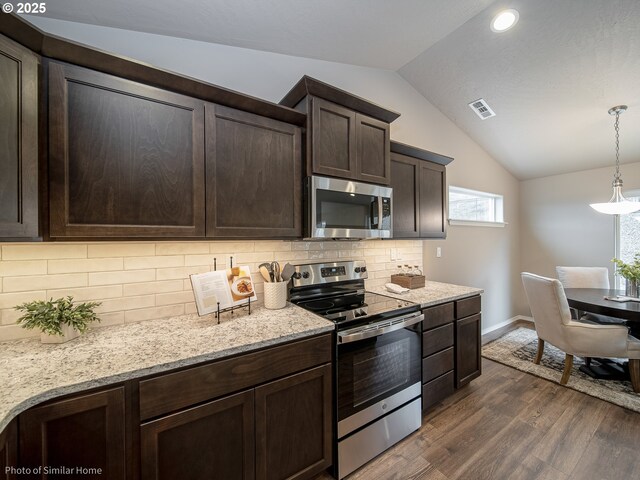 885 Yoss Pl, Cottage Grove, OR 97424 - kitchen featuring appliances with stainless steel finishes, dark brown cabinets, lofted ceiling, dark wood-style floors, and baseboards