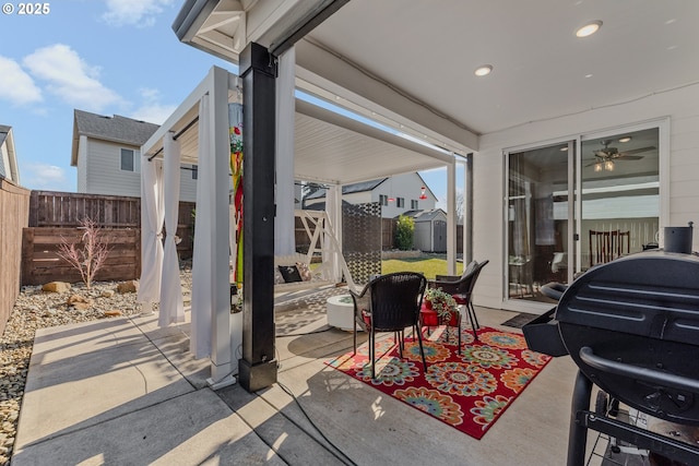 view of patio / terrace with a storage unit, an outdoor structure, and a fenced backyard