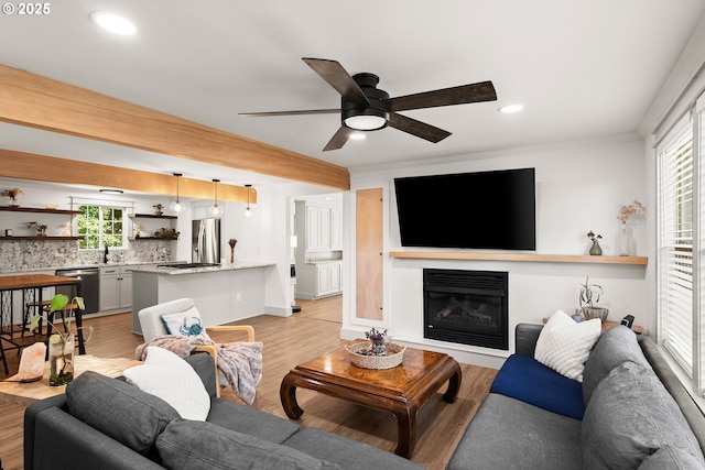 22692 SW Highland Dr, Sherwood, OR 97140 - living area featuring light wood-type flooring, a ceiling fan, recessed lighting, and a glass covered fireplace