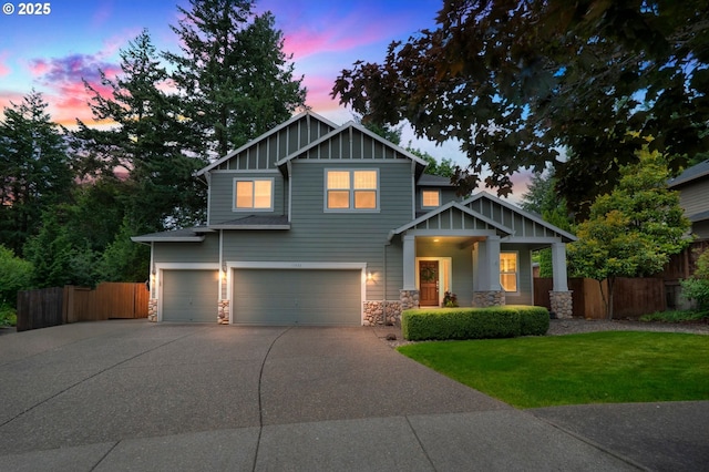 11433 SE Bethany Dr, Happy Valley, OR 97086 - craftsman-style home with stone siding, a garage, a porch, board and batten siding, and concrete driveway