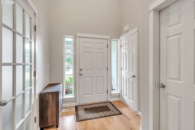 11433 SE Bethany Dr, Happy Valley, OR 97086 - foyer with light wood-style flooring and a high ceiling