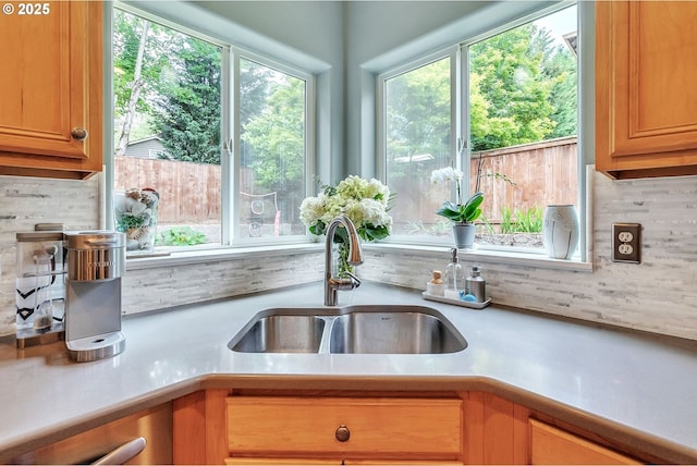 11433 SE Bethany Dr, Happy Valley, OR 97086 - kitchen with plenty of natural light, stainless steel dishwasher, light countertops, and tasteful backsplash