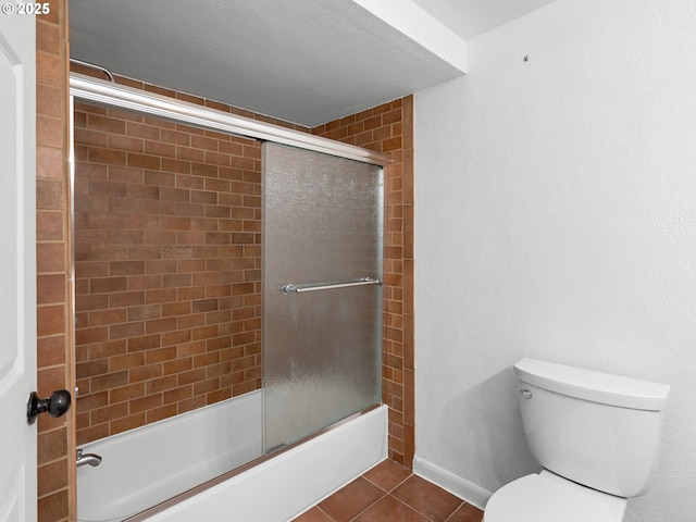 6310 SW 35th Ave, Portland, OR 97221 - bathroom featuring combined bath / shower with glass door and tile patterned floors