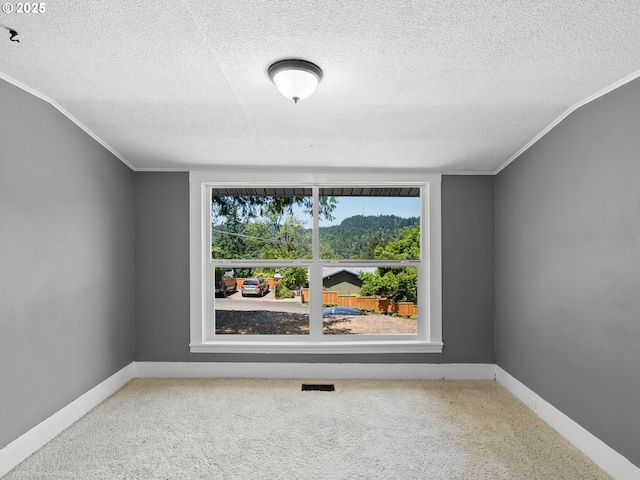 6310 SW 35th Ave, Portland, OR 97221 - carpeted spare room with a textured ceiling and crown molding