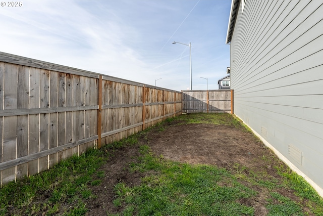 view of yard featuring a fenced backyard