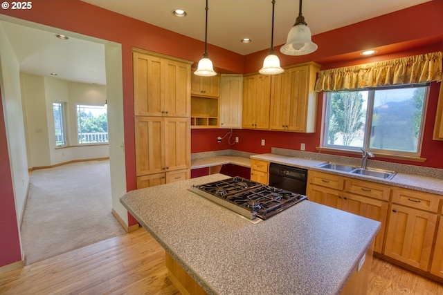 1317 Riggleman Ln, White Salmon, WA 98672 - kitchen with a sink, black dishwasher, gas stovetop, a kitchen island, and baseboards