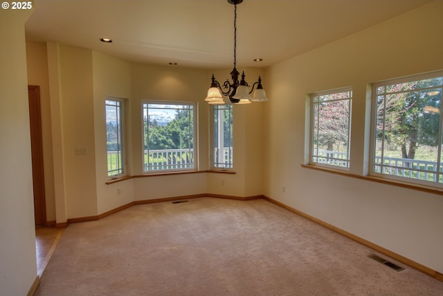1317 Riggleman Ln, White Salmon, WA 98672 - unfurnished room with healthy amount of natural light, carpet floors, a chandelier, baseboards, and recessed lighting