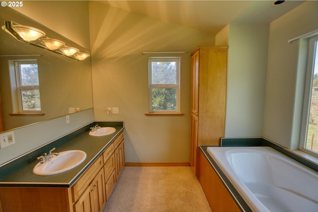 1317 Riggleman Ln, White Salmon, WA 98672 - full bath featuring double vanity, healthy amount of natural light, a garden tub, and vaulted ceiling