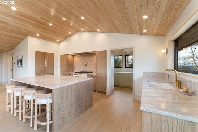 11625 NE Hoskins Hill Rd, Newberg, OR 97132 - kitchen featuring a sink, wood ceiling, modern cabinets, vaulted ceiling, and light wood-type flooring