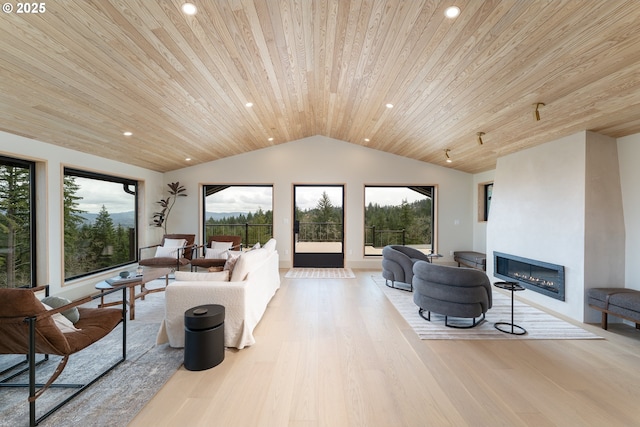 11625 NE Hoskins Hill Rd, Newberg, OR 97132 - living area with wood ceiling, vaulted ceiling, a glass covered fireplace, light wood-style floors, and recessed lighting