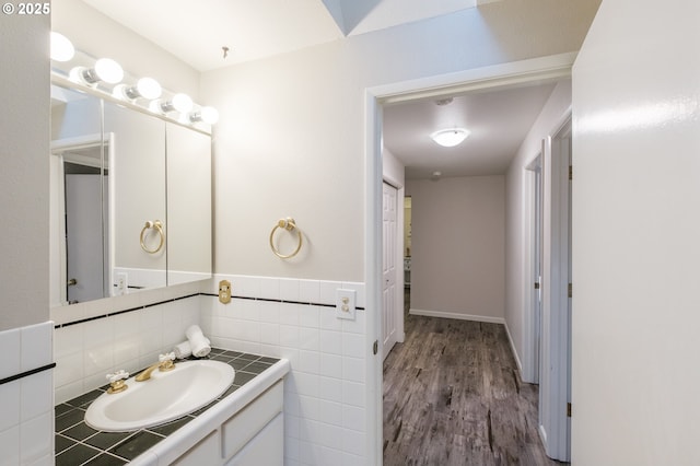 3727 NW Arrowood Cir, Corvallis, OR 97330 - bathroom with wood finished floors, vanity, and tile walls