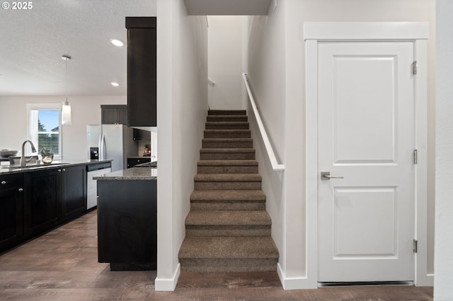 2360 N R St, Washougal, WA 98671 - staircase with wood finished floors, recessed lighting, and a textured ceiling