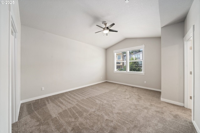 2360 N R St, Washougal, WA 98671 - unfurnished bedroom with carpet, vaulted ceiling, a textured ceiling, and a ceiling fan