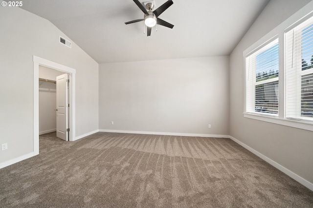 2360 N R St, Washougal, WA 98671 - unfurnished bedroom with vaulted ceiling, carpet, a walk in closet, ceiling fan, and a closet