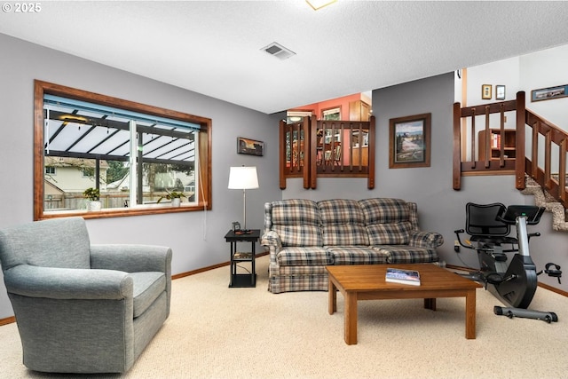 carpeted living room with visible vents, baseboards, stairway, vaulted ceiling, and a textured ceiling