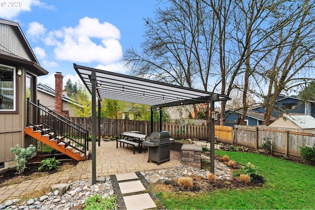 view of yard featuring a patio, a fenced backyard, and a pergola