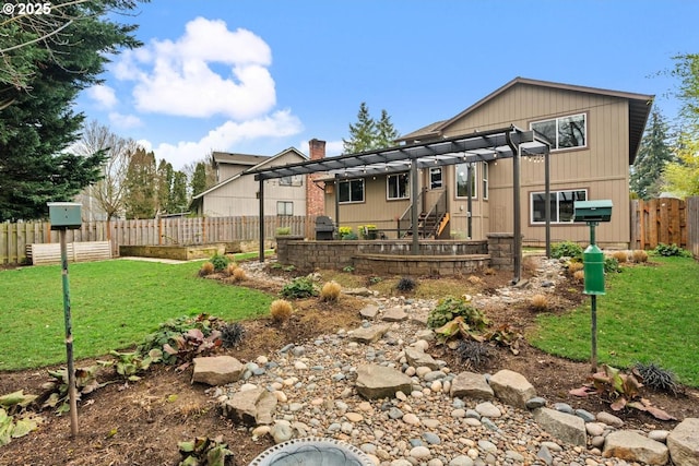 back of property with a chimney, a lawn, a pergola, and a fenced backyard