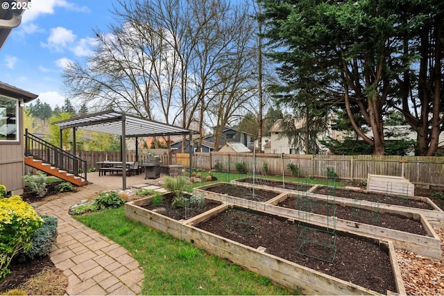 view of yard featuring stairs, a garden, a patio area, and fence