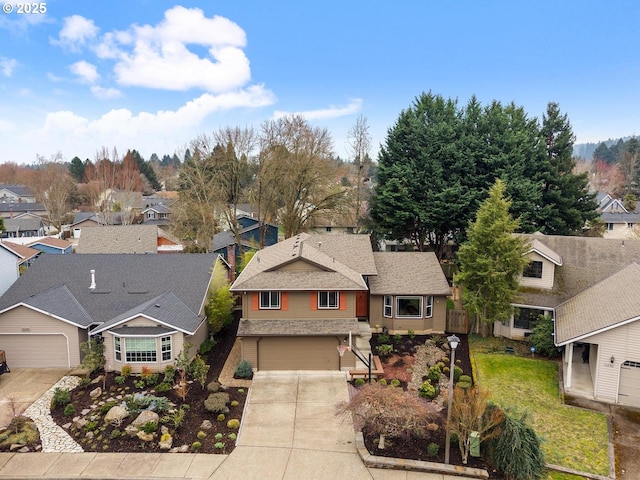 birds eye view of property with a residential view