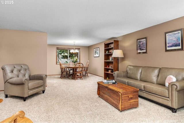 living room with carpet and a chandelier