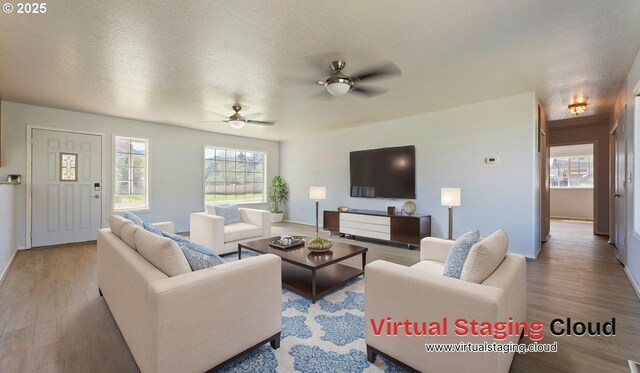 151 E Date St, Powers, OR 97466 - living area with wood finished floors, a ceiling fan, healthy amount of natural light, baseboards, and a textured ceiling