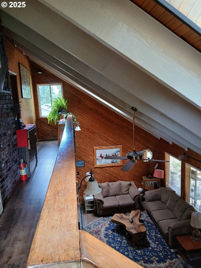 9655 8th St, Bay City, OR 97107 - living area with wooden walls, wood finished floors, and a ceiling fan