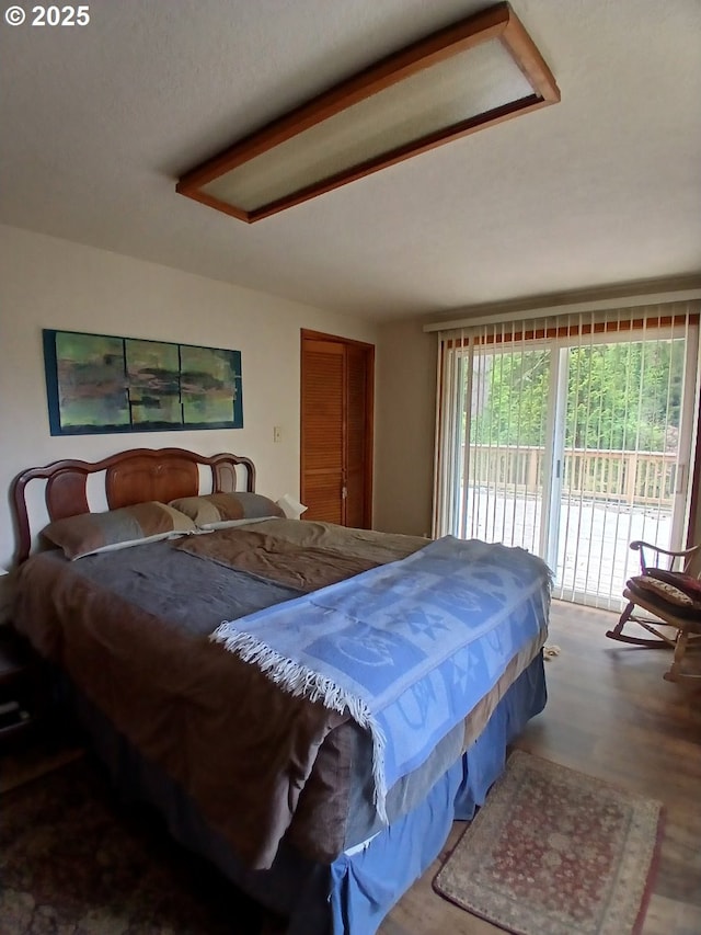 9655 8th St, Bay City, OR 97107 - bedroom featuring access to outside and wood finished floors