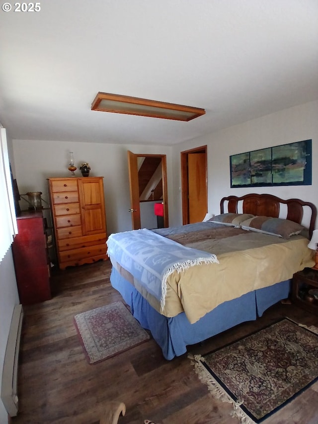 9655 8th St, Bay City, OR 97107 - bedroom with wood finished floors and a baseboard heating unit