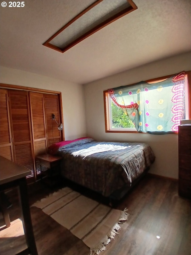 9655 8th St, Bay City, OR 97107 - bedroom featuring wood finished floors and a closet