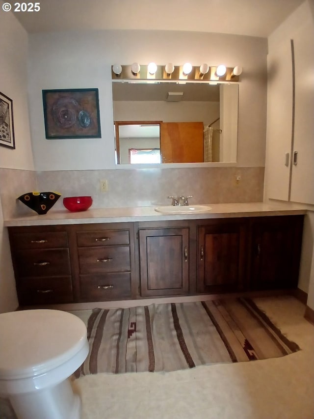 9655 8th St, Bay City, OR 97107 - bathroom with vanity, tasteful backsplash, a shower with shower curtain, and wood finished floors