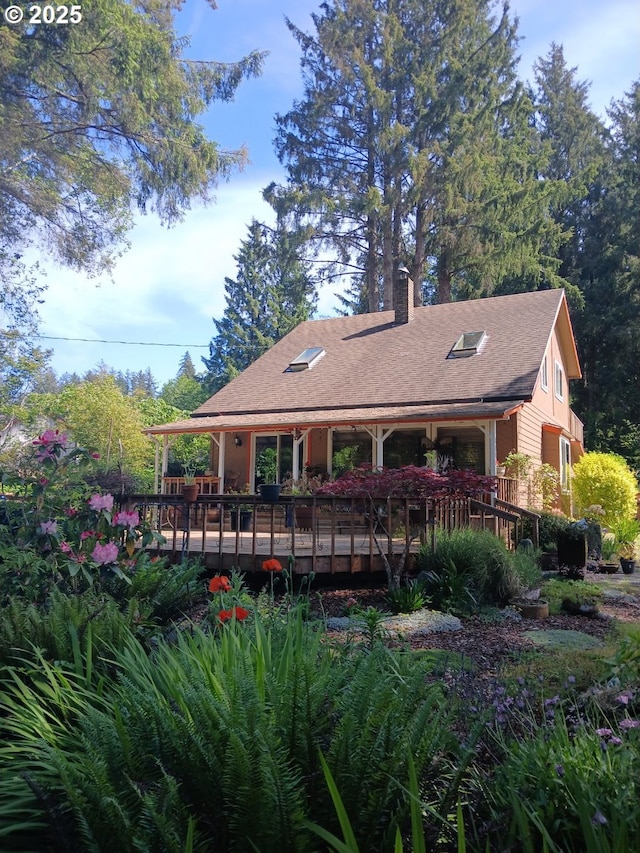 9655 8th St, Bay City, OR 97107 - rear view of property with a chimney, a deck, and a shingled roof