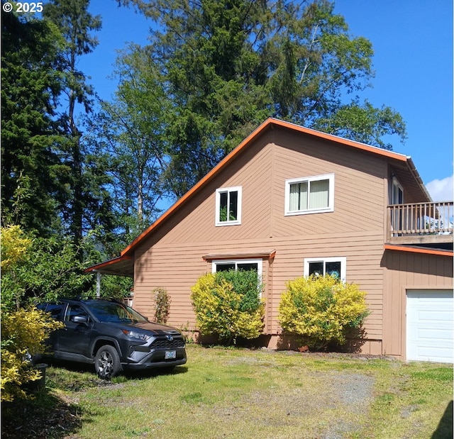 9655 8th St, Bay City, OR 97107 - view of side of home with a lawn and a garage