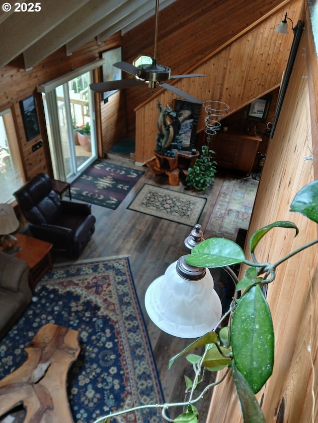 9655 8th St, Bay City, OR 97107 - living room with wooden walls, vaulted ceiling, and wood finished floors