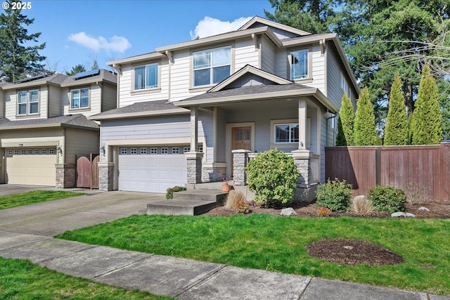 view of front of home featuring stone siding, concrete driveway, fence, and an attached garage