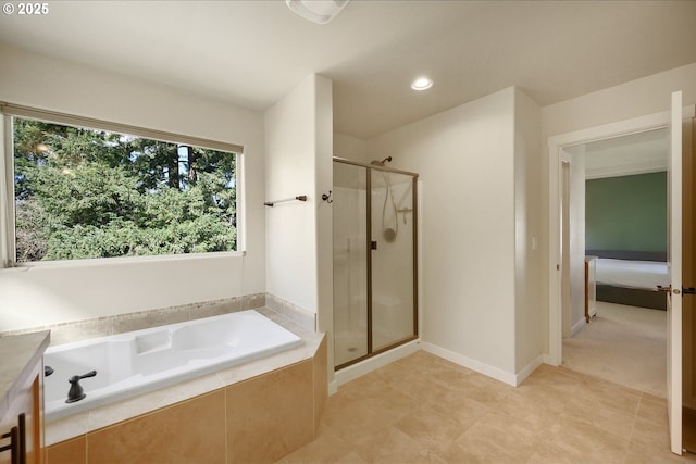 bathroom featuring a garden tub, baseboards, a shower stall, and recessed lighting