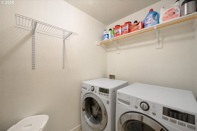 laundry room featuring laundry area and washer and clothes dryer