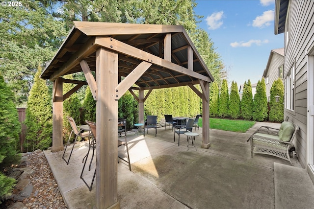 view of patio with a gazebo and outdoor dining area