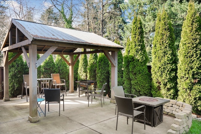 view of patio / terrace featuring a fire pit and a gazebo