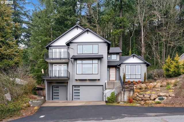 view of front facade featuring a garage and a balcony