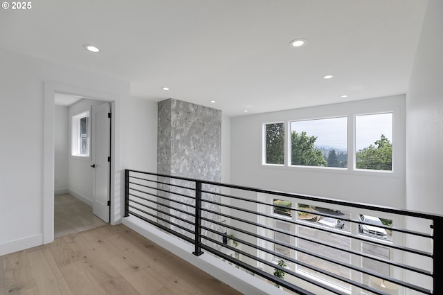 corridor with light hardwood / wood-style flooring