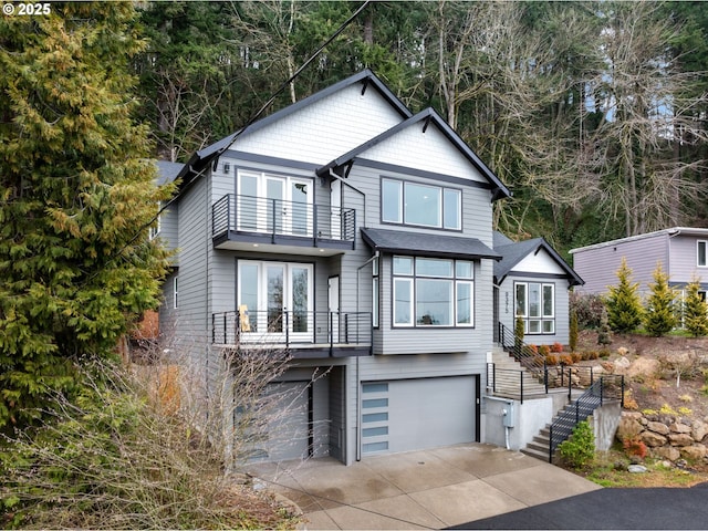 view of front of home with a balcony and a garage