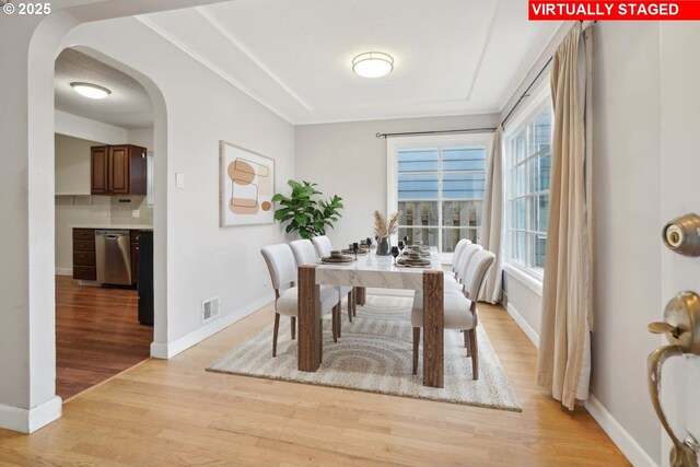 6536 SE Flavel St, Portland, OR 97206 - unfurnished room with healthy amount of natural light, a textured ceiling, light wood finished floors, crown molding, and baseboards