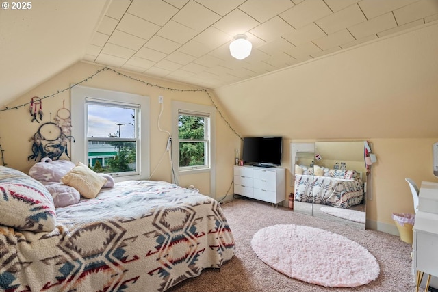 carpeted bedroom featuring lofted ceiling