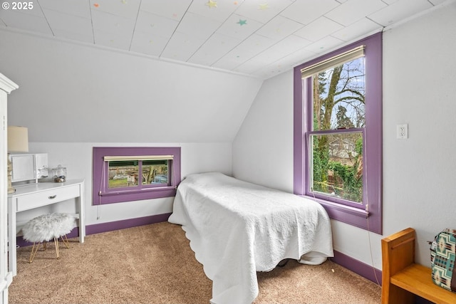 carpeted bedroom with vaulted ceiling