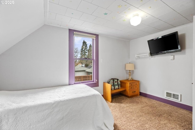 carpeted bedroom featuring vaulted ceiling